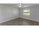 Bright bedroom with a ceiling fan, closet and a large window allowing plenty of natural light at 4878 Tangerine Ave # 4878, Winter Park, FL 32792