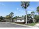 Exterior view of well-maintained villas with palm trees along the street at 4878 Tangerine Ave # 4878, Winter Park, FL 32792