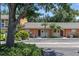 Cozy townhome featuring neutral paint, well maintained landscaping, and a parking area at 4878 Tangerine Ave # 4878, Winter Park, FL 32792