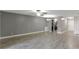 Open-concept living area with updated wood floors, gray walls, and modern lighting at 4878 Tangerine Ave # 4878, Winter Park, FL 32792