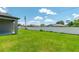 Spacious backyard featuring lush green grass and a white fence, perfect for outdoor activities and privacy at 506 Marion Oaks Trl, Ocala, FL 34473