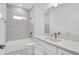 Bathroom with tiled shower and white cabinets at 506 Marion Oaks Trl, Ocala, FL 34473