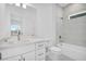 Elegant bathroom featuring modern fixtures, white cabinetry, and a tiled shower/tub combination at 506 Marion Oaks Trl, Ocala, FL 34473