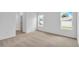 Bright bedroom with two windows and neutral carpet at 506 Marion Oaks Trl, Ocala, FL 34473