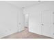 Bedroom featuring neutral carpeting, white walls, and convenient interior door access at 506 Marion Oaks Trl, Ocala, FL 34473