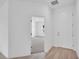 Bright entryway with light wood flooring and a view into the carpeted living space at 506 Marion Oaks Trl, Ocala, FL 34473
