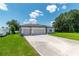 Beautifully designed single-story home with three-car garage and a spacious driveway, perfect for families at 506 Marion Oaks Trl, Ocala, FL 34473