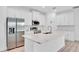 Kitchen with stainless steel refrigerator, microwave, and white cabinets at 506 Marion Oaks Trl, Ocala, FL 34473