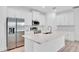 Close up of kitchen island with stainless steel appliances and modern backsplash at 506 Marion Oaks Trl, Ocala, FL 34473