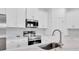 Detailed shot of new stainless steel appliances and tile backsplash at 506 Marion Oaks Trl, Ocala, FL 34473