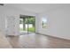 Spacious room with door to patio and backyard view at 506 Marion Oaks Trl, Ocala, FL 34473