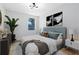 This modern bedroom has a serene vibe, complemented by its stylish décor and cozy ambiance at 5116 Sorrento W Blvd, St Cloud, FL 34771