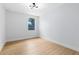 Light filled bedroom with a large window, sleek floors, and modern lighting at 5116 Sorrento W Blvd, St Cloud, FL 34771