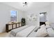 Stylishly staged bedroom featuring a decorative plant and light-colored furniture at 5116 Sorrento W Blvd, St Cloud, FL 34771