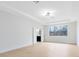 Open bedroom features a large window, smooth floors, and access to bathroom at 5116 Sorrento W Blvd, St Cloud, FL 34771