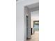 Bright hallway leading to a kitchen with stainless steel appliances and views of the backyard at 5116 Sorrento W Blvd, St Cloud, FL 34771