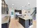 Modern kitchen with granite countertops, dark cabinets and stainless steel appliances at 5116 Sorrento W Blvd, St Cloud, FL 34771