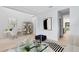 Open-concept living room with a desk area, modern decor, hardwood floors, and ample natural light at 5116 Sorrento W Blvd, St Cloud, FL 34771