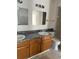 Bathroom featuring a double vanity, countertop, and a shower/tub combo at 5291 Images Cir # 301, Kissimmee, FL 34746