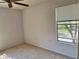 This bedroom has carpet and a window that lets in natural light at 5291 Images Cir # 301, Kissimmee, FL 34746
