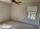 Bedroom with carpet, a window with blinds, and a ceiling fan at 5291 Images Cir # 301, Kissimmee, FL 34746