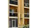 Exterior facade displaying the building number and balconies on a three story building at 5291 Images Cir # 301, Kissimmee, FL 34746