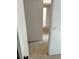 Hallway with neutral carpet and white walls leading to other rooms at 5291 Images Cir # 301, Kissimmee, FL 34746