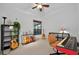 Bedroom featuring an electric piano, guitars, and a window at 602 Nighthawk Cir, Winter Springs, FL 32708