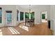 A bright breakfast nook features hardwood floors, natural light, and exterior access at 602 Nighthawk Cir, Winter Springs, FL 32708