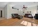 Spacious living room with wood flooring, comfortable sofas, and ample natural light at 602 Nighthawk Cir, Winter Springs, FL 32708