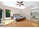 Open main bedroom with ensuite bathroom, wood floors, ceiling fan, and sliding glass door at 602 Nighthawk Cir, Winter Springs, FL 32708