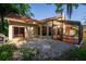 Rear facade of the home showing the patio and screened porch at 602 Nighthawk Cir, Winter Springs, FL 32708