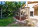 Screened patio with brick floor and view of backyard at 602 Nighthawk Cir, Winter Springs, FL 32708