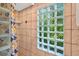 Shower with stylish tile and glass block window at 602 Nighthawk Cir, Winter Springs, FL 32708