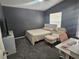 This cozy bedroom boasts modern décor and furnishings at 6436 Fig Leaf St, Magnolia Square, FL 34771