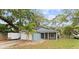Charming single-story home with a well-manicured lawn and a cozy covered entryway at 6436 Fig Leaf St, Magnolia Square, FL 34771