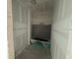 Unfinished bathroom with a bathtub and concrete floors and walls at 706 Junonia Blvd, New Smyrna Beach, FL 32168