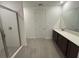 Bathroom with modern shower, double vanity, and clean, neutral finishes at 706 Junonia Blvd, New Smyrna Beach, FL 32168