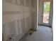 Unfinished bathroom shows plumbing fixtures and a door to the outside at 706 Junonia Blvd, New Smyrna Beach, FL 32168