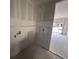 Unfinished bathroom features plumbing and a window to the exterior at 706 Junonia Blvd, New Smyrna Beach, FL 32168
