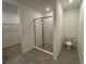 Bathroom with shower and toilet, featuring modern fixtures and finishes at 706 Junonia Blvd, New Smyrna Beach, FL 32168