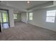 Spacious bedroom with lots of natural light, neutral carpet, and recessed lighting at 706 Junonia Blvd, New Smyrna Beach, FL 32168