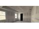 Unfinished bedroom with concrete floors and two windows at 706 Junonia Blvd, New Smyrna Beach, FL 32168