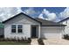Charming single-story home with a brick driveway and well-maintained landscaping at 706 Junonia Blvd, New Smyrna Beach, FL 32168