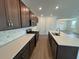 Modern kitchen with stainless steel appliances, ample cabinet space, and island sink at 706 Junonia Blvd, New Smyrna Beach, FL 32168