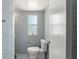 This is a clean bathroom with a tile shower and a window at 7712 Hoosier Pl, Orlando, FL 32807