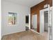 Bedroom with a view to the pool area, a mirrored wall and a closet, creating a functional and relaxing space at 7712 Hoosier Pl, Orlando, FL 32807