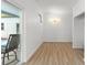 Bright bonus room with wood flooring and sliding door access to the backyard pool at 7712 Hoosier Pl, Orlando, FL 32807