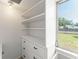 Functional storage space with built-in drawers and shelves, perfect for organizing and maximizing room efficiency at 7712 Hoosier Pl, Orlando, FL 32807
