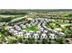 Aerial view showcasing a large townhouse community near golf course and highway at 7770 Sandy Ridge Dr # 234, Reunion, FL 34747